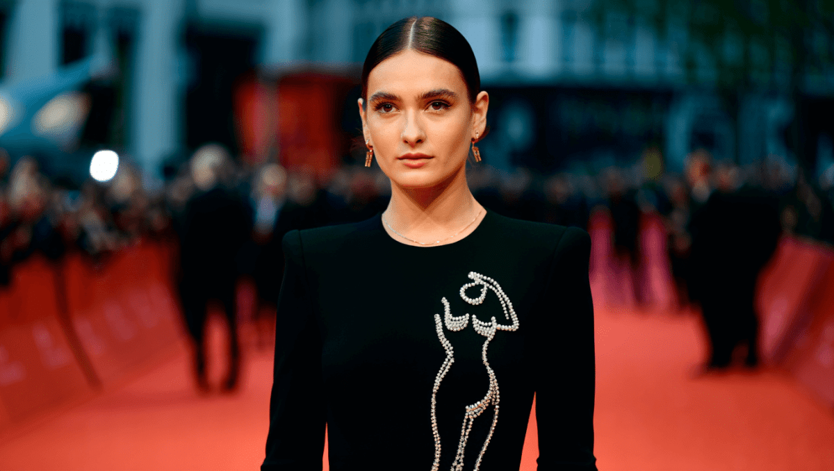 Jeanne Cadieu stuns in 'naked' dress at The Bride! premiere with Jake Gyllenhaal in rare red carpet moment