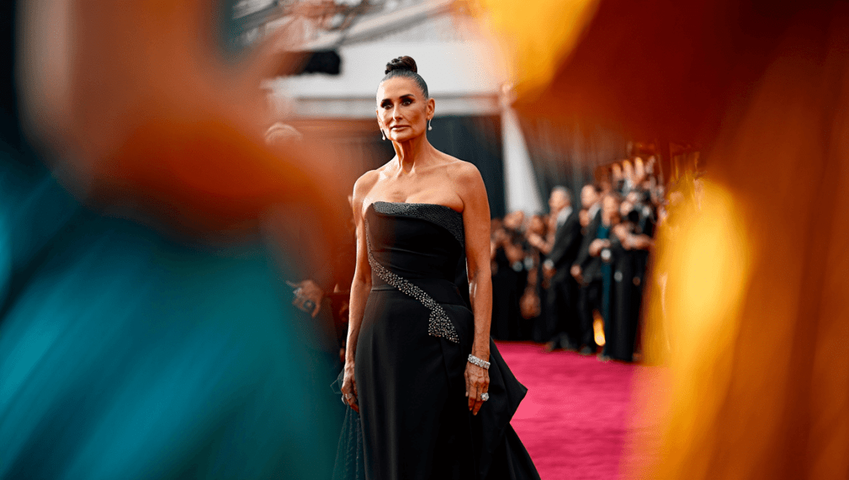 Demi Moore stuns at 2026 Oscars in black and green feathered gown