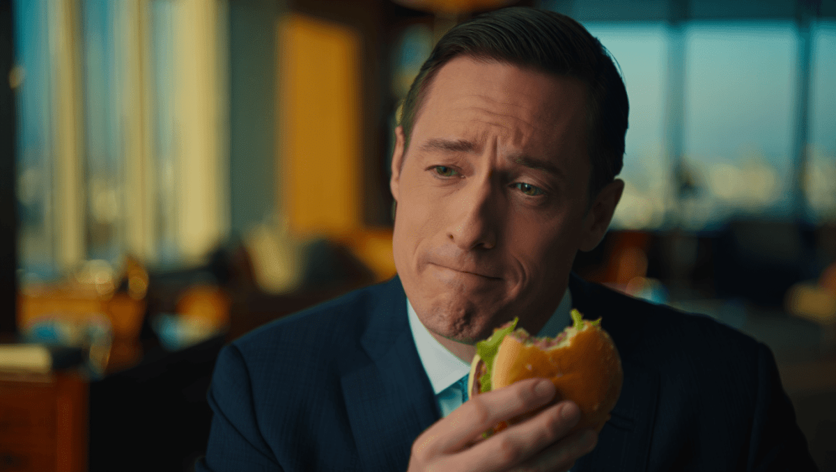 Chris Kempczinski blames mom's etiquette advice for viral burger bite