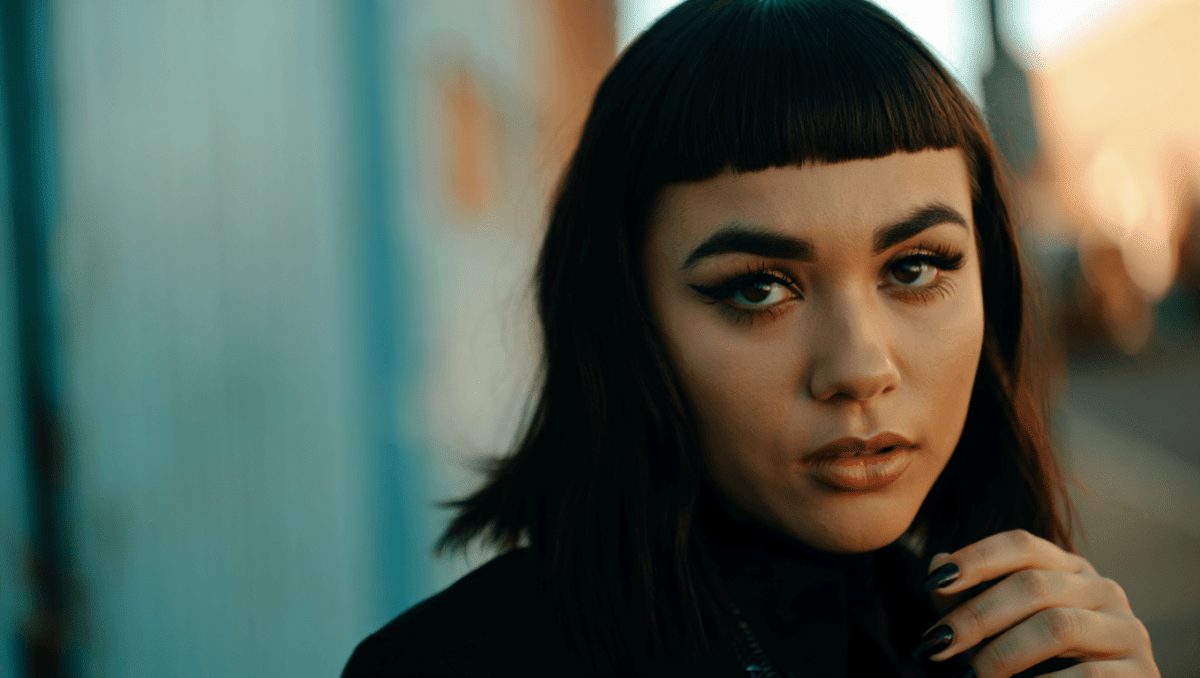 Sabrina Carpenter ditches blonde curls for jet-black hair with blunt bangs on Perfect cover