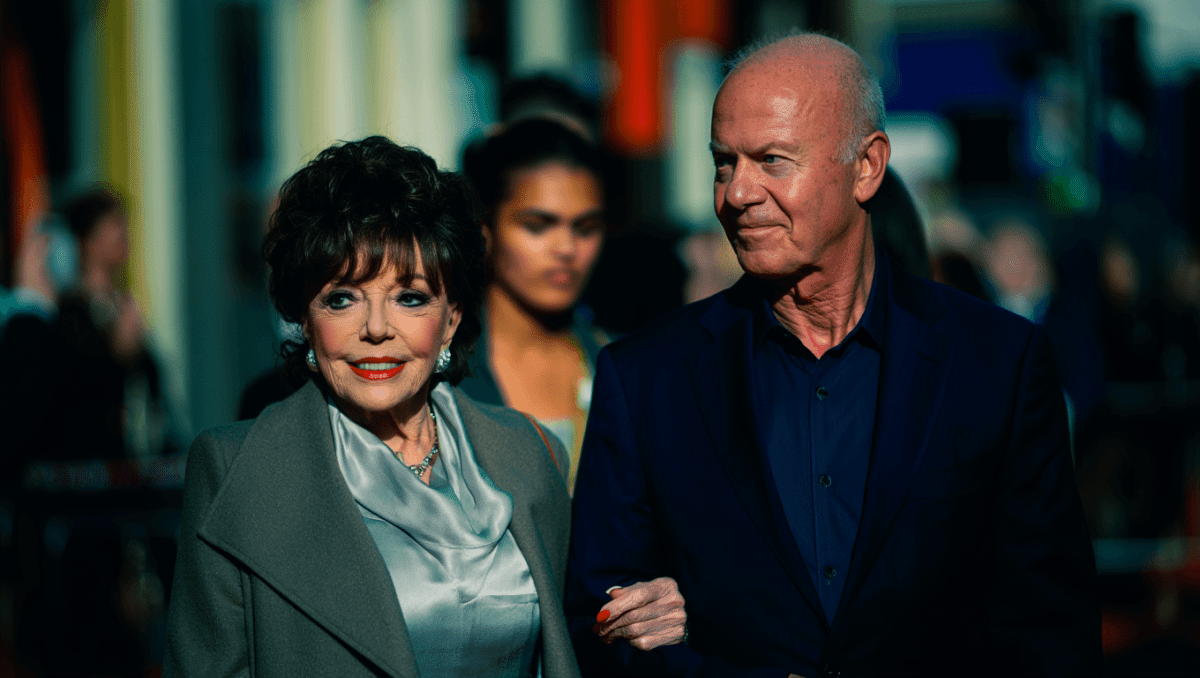 Joan Collins turns heads at M&S launch, 92, in silver blouse and grey coat