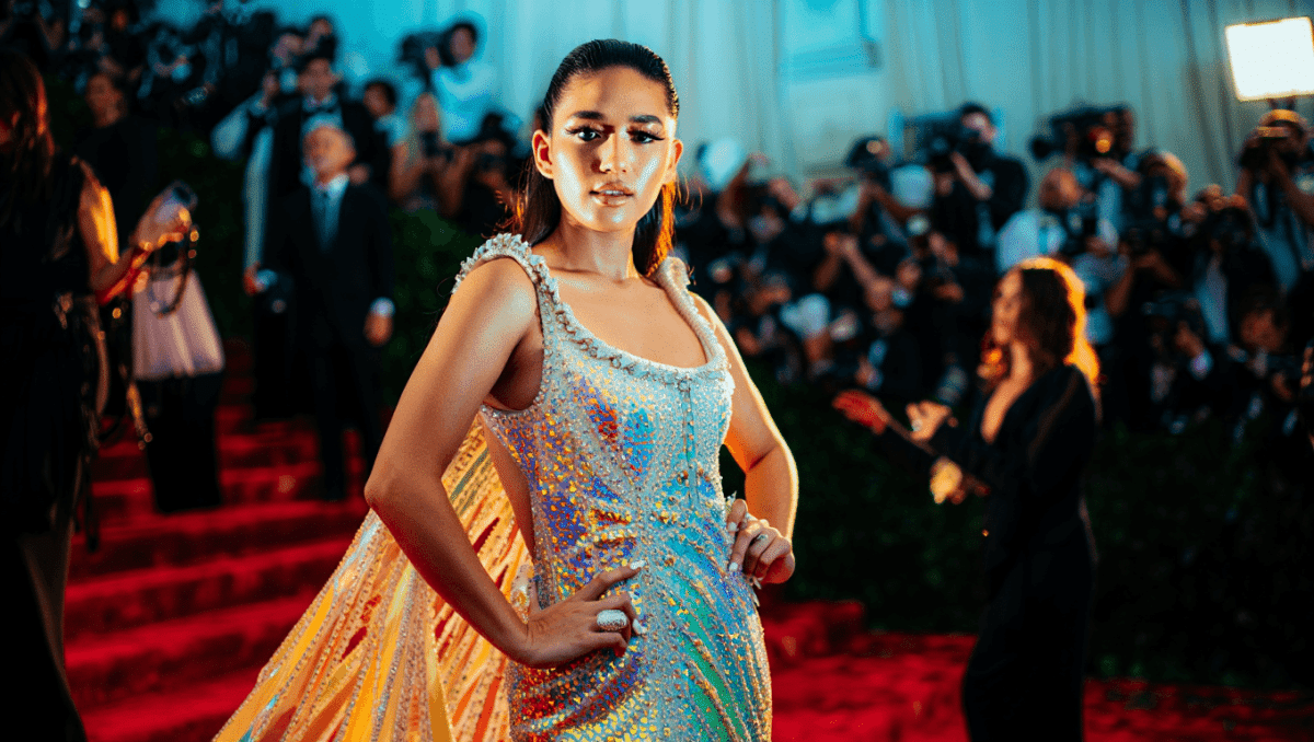 Chase Infiniti makes Met Gala debut in New York in colorful Thom Browne gown