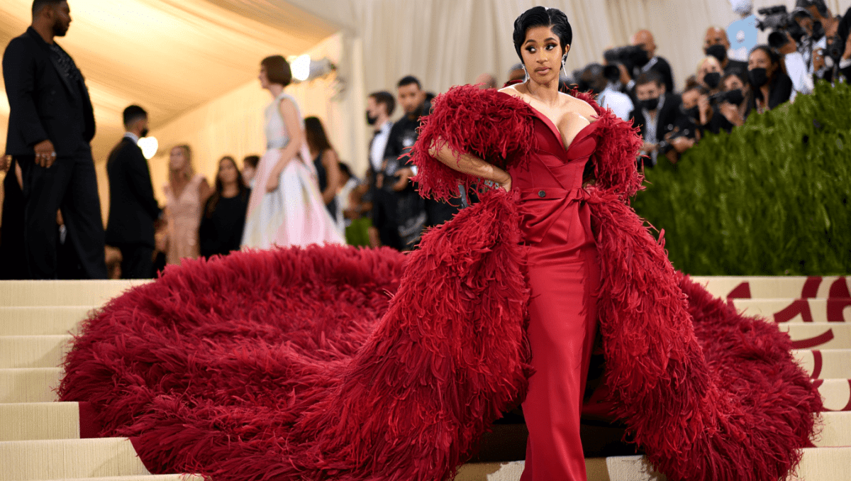 Cardi B stuns at Met Gala in dramatic Thom Browne oxblood gown with feathered train