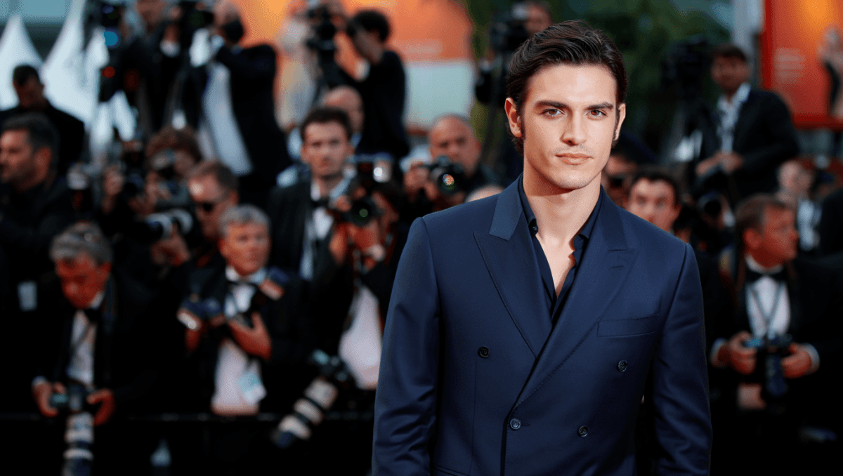 Lucas Bravo attends Cannes Film Festival 2026 opening ceremony in navy tailored suit