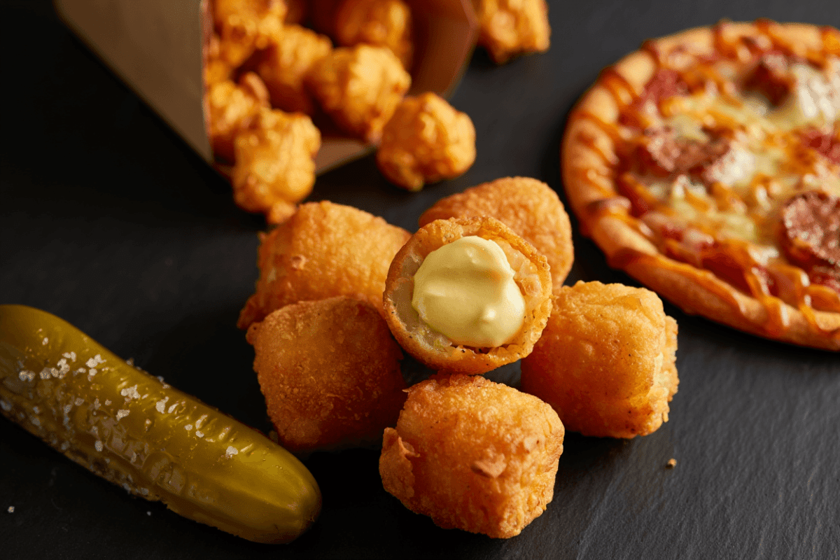 AMC theatres expands menu nationwide with Street Corn Poppers, Hot Honey Sausage Pizza