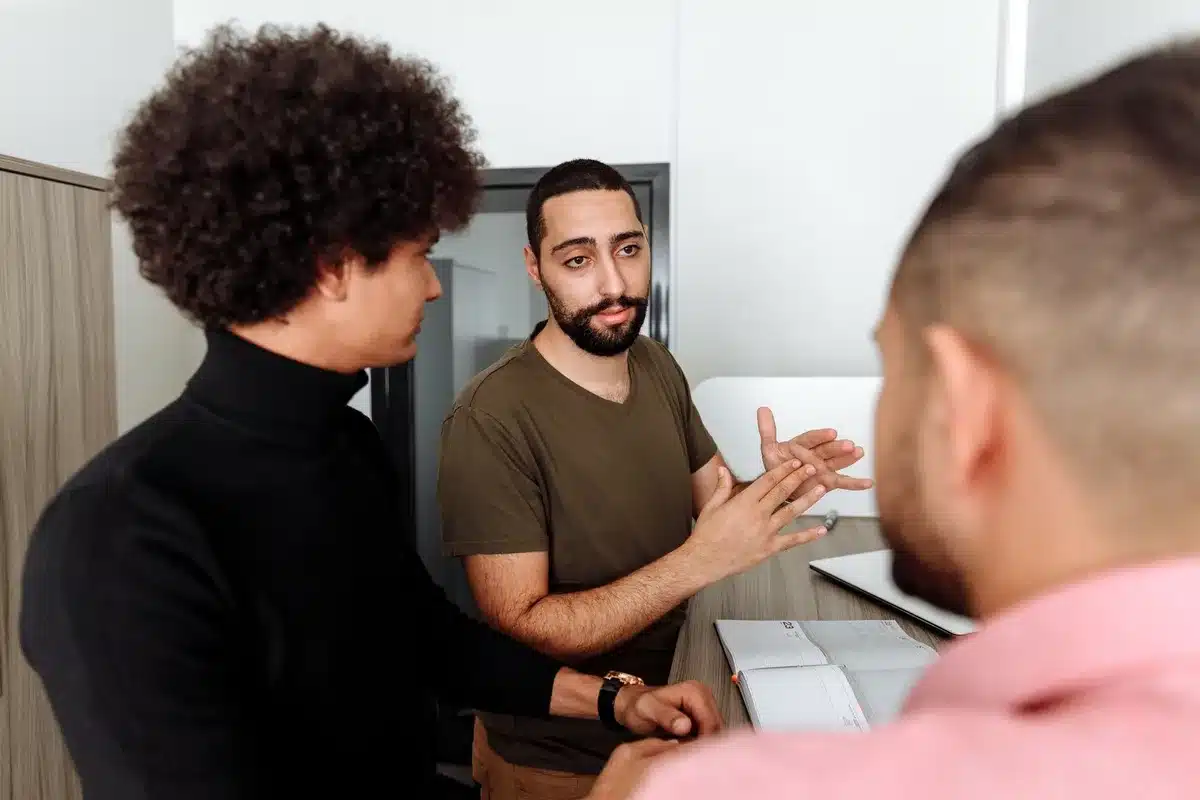 People of different backgrounds engaged in thoughtful conversation