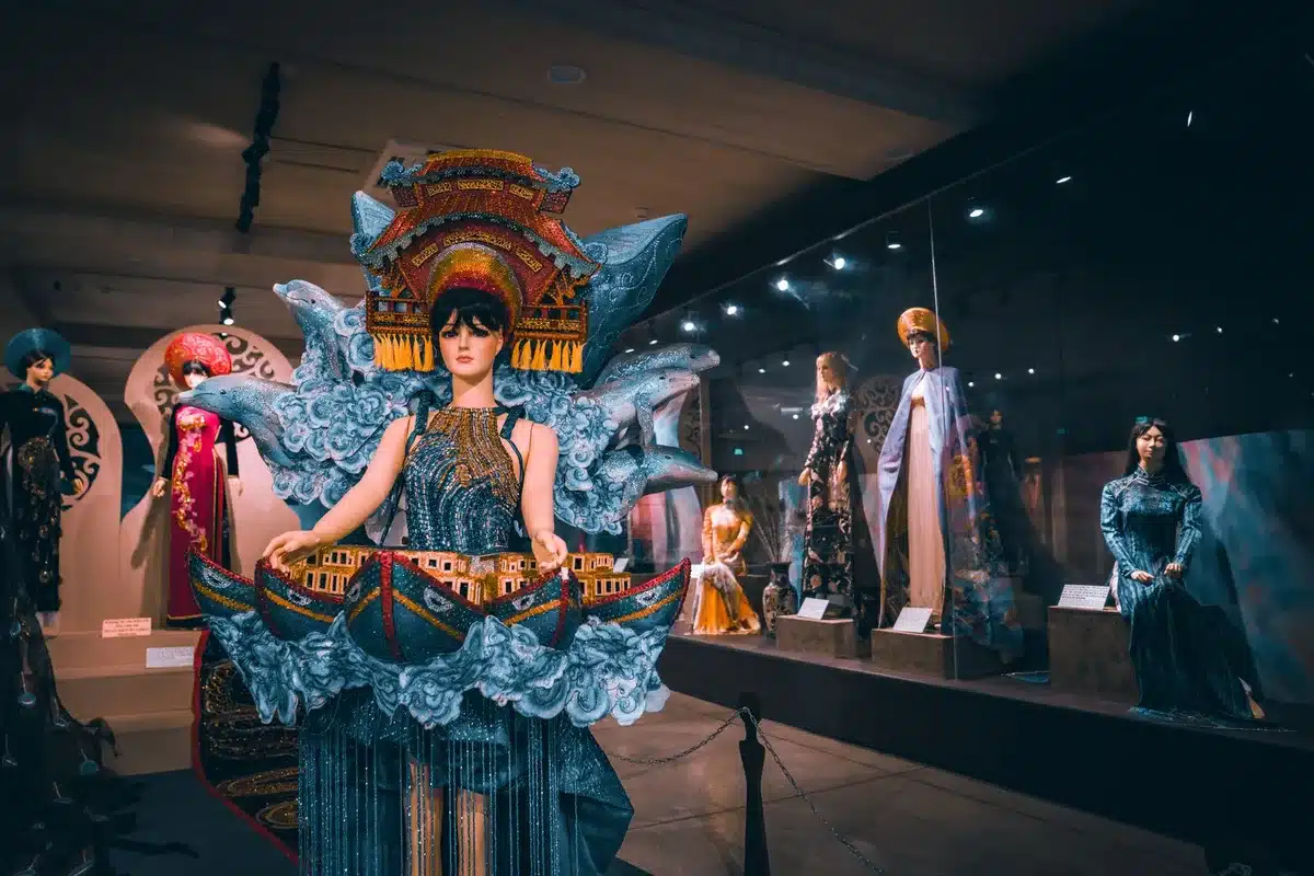 Museum display showing vintage performance clothing and accessories on mannequins