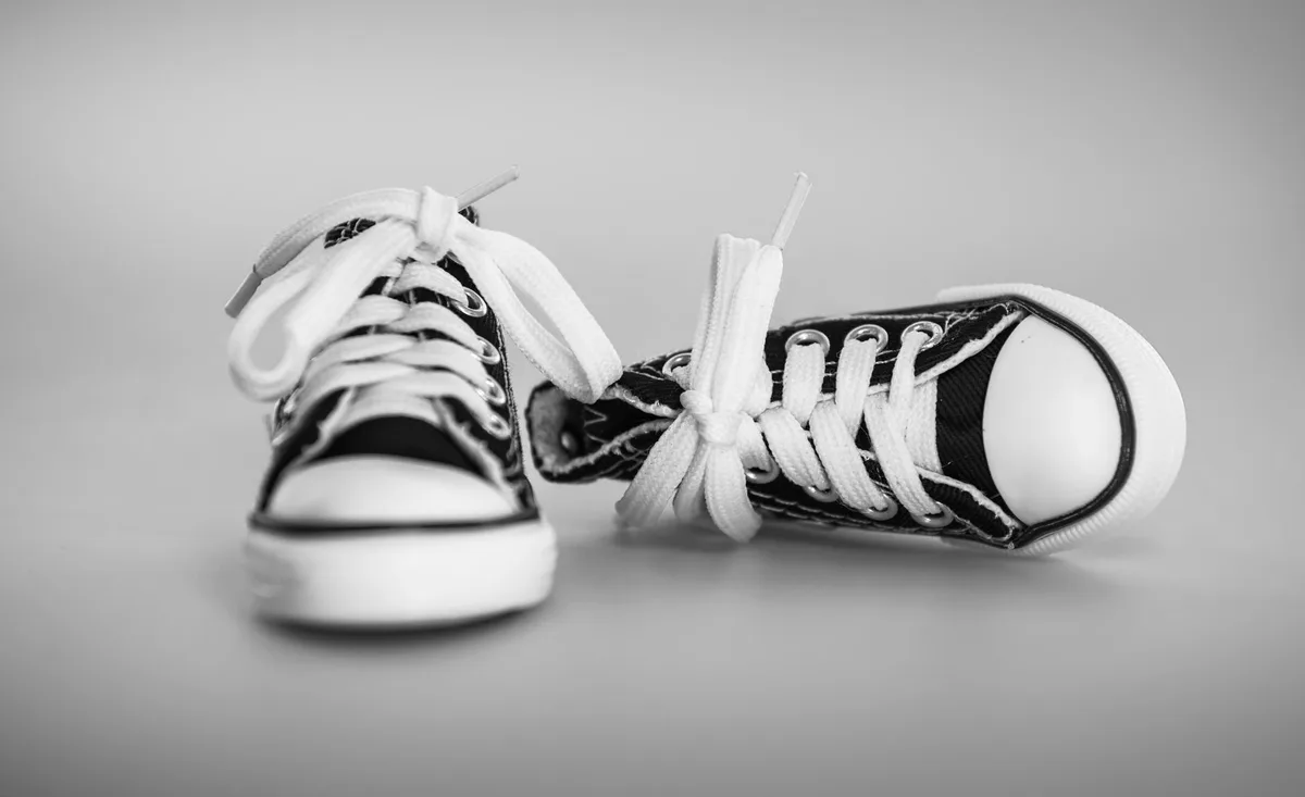 Close-up of a colorful, ornate animated character shoe under spotlight