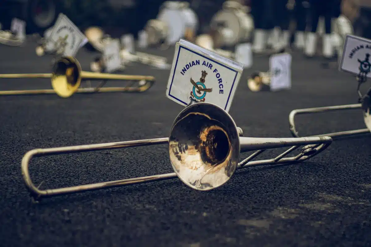 Marching band members performing physical conditioning drills during rehearsal