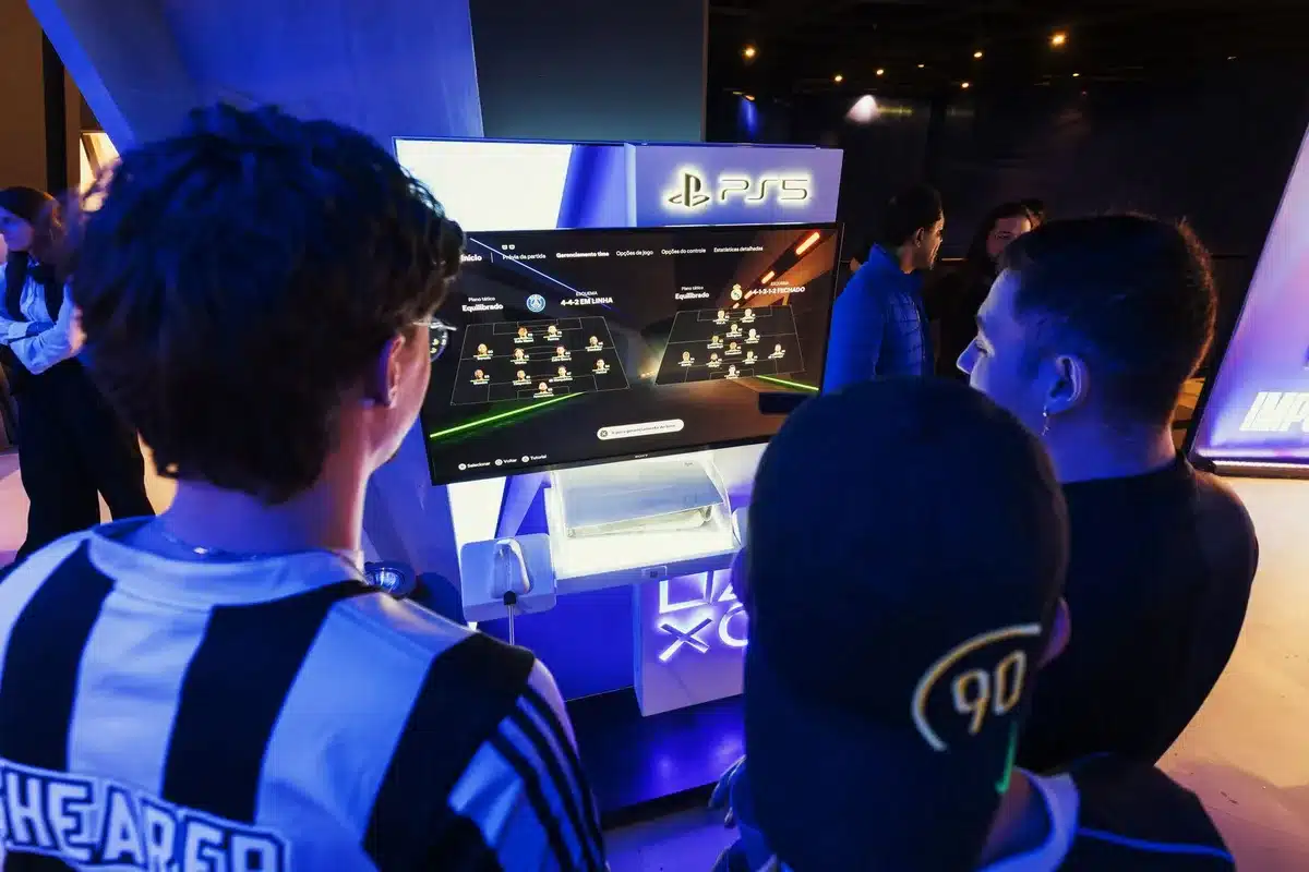 Player focused on competitive Madden gaming with controller and screen