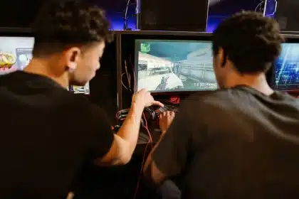 Modern gaming setup with arcade cabinets and console controllers in a private facility