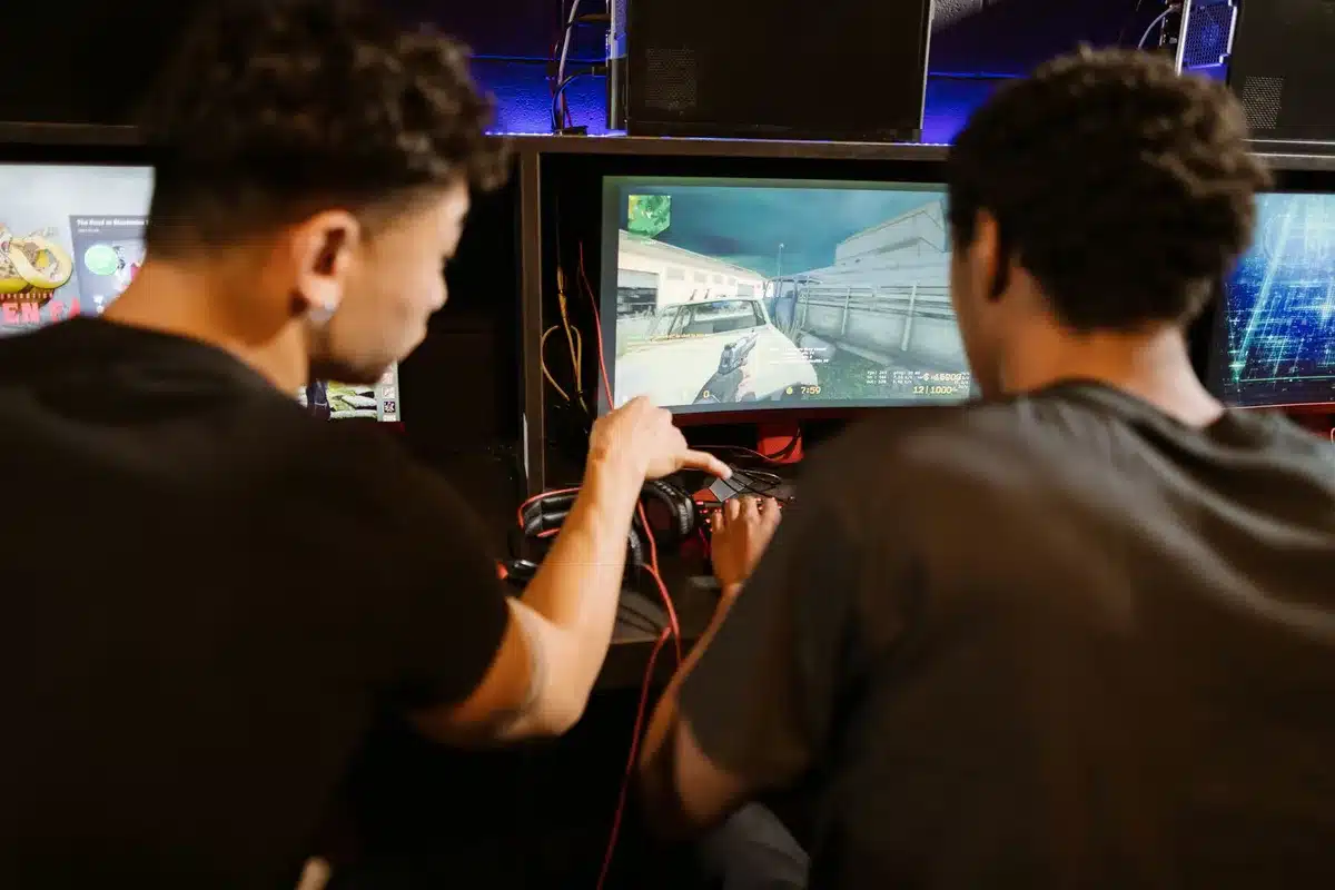 Modern gaming setup with arcade cabinets and console controllers in a private facility