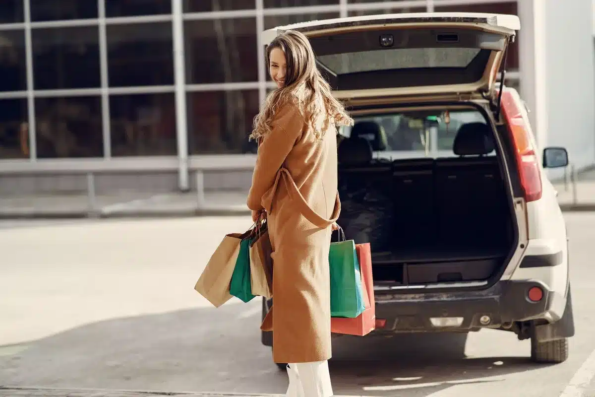 Shopper with shopping bags in a retail environment