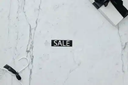 Shopping bags filled with discounted luxury items like sneakers and beauty products
