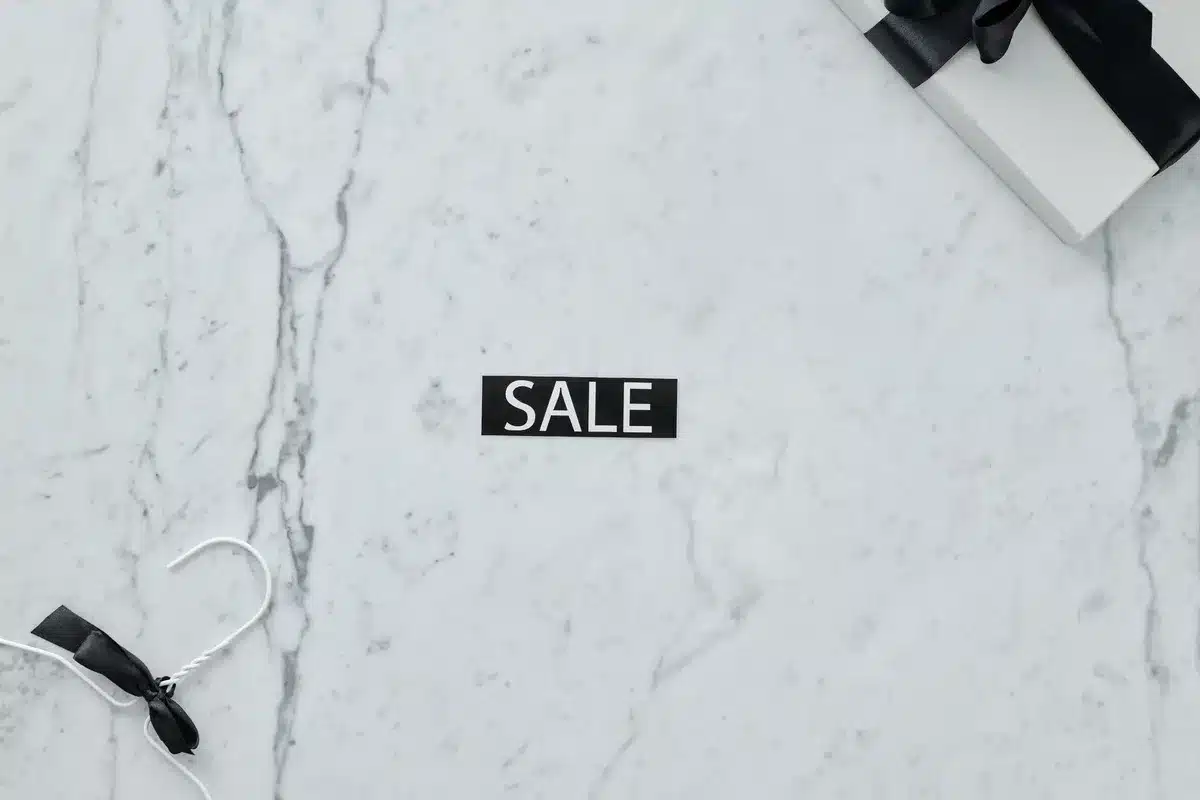 Shopping bags filled with discounted luxury items like sneakers and beauty products
