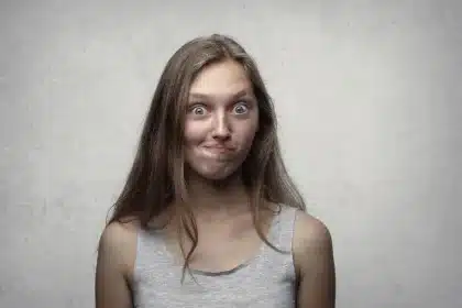 Deadpan facial expression juxtaposed with classical or ornate text, illustrating the meme's contrast between highbrow la