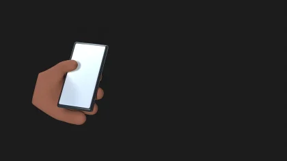 Hands holding an open foldable smartphone with dual screens lit up
