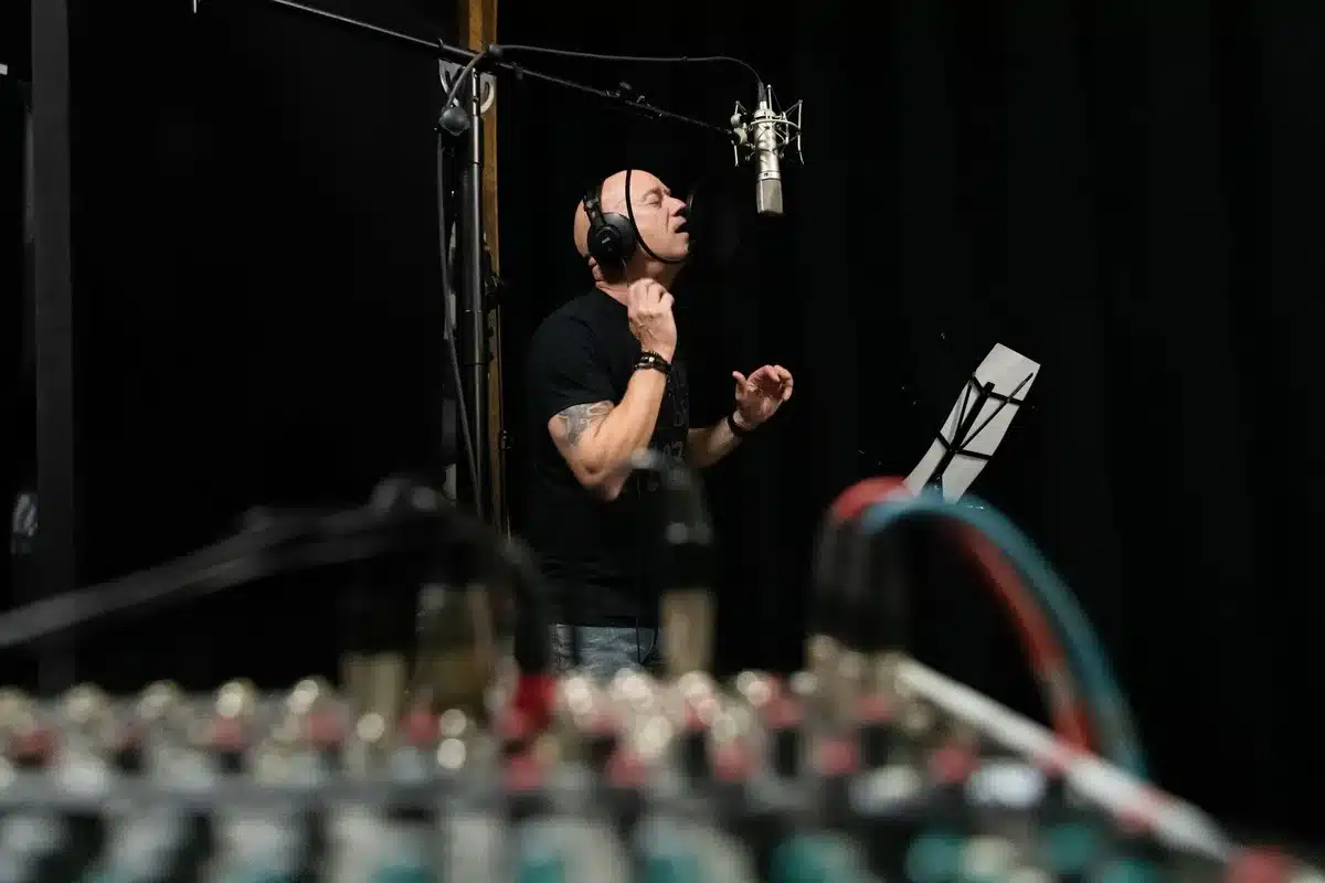 Artist working in a recording studio during the creative songwriting process