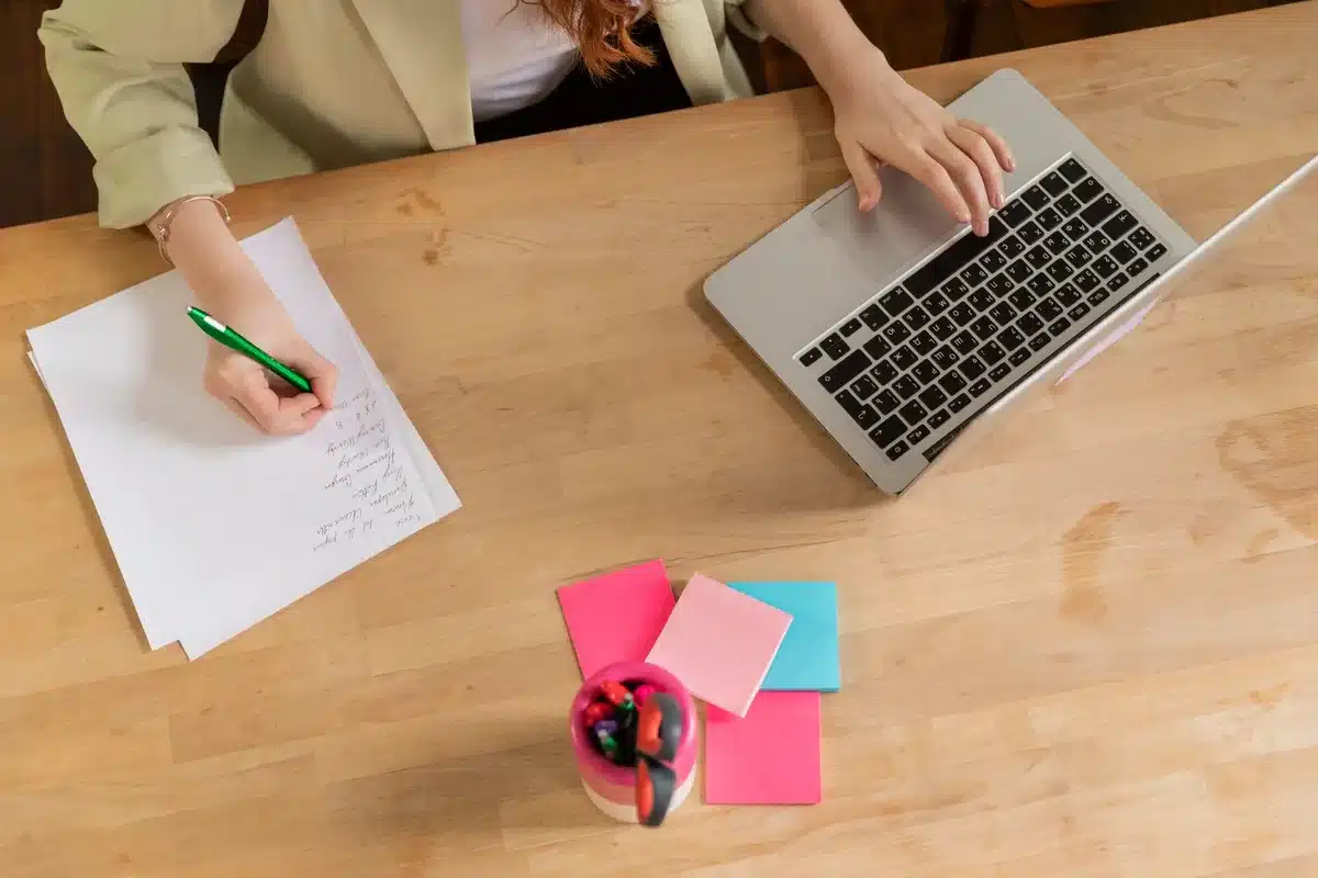 Someone filling out a personality quiz on paper with a pen