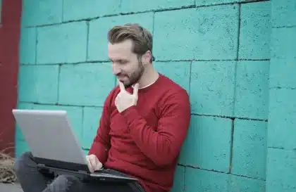 Person taking a personality quiz on laptop to find their ideal reality TV show match