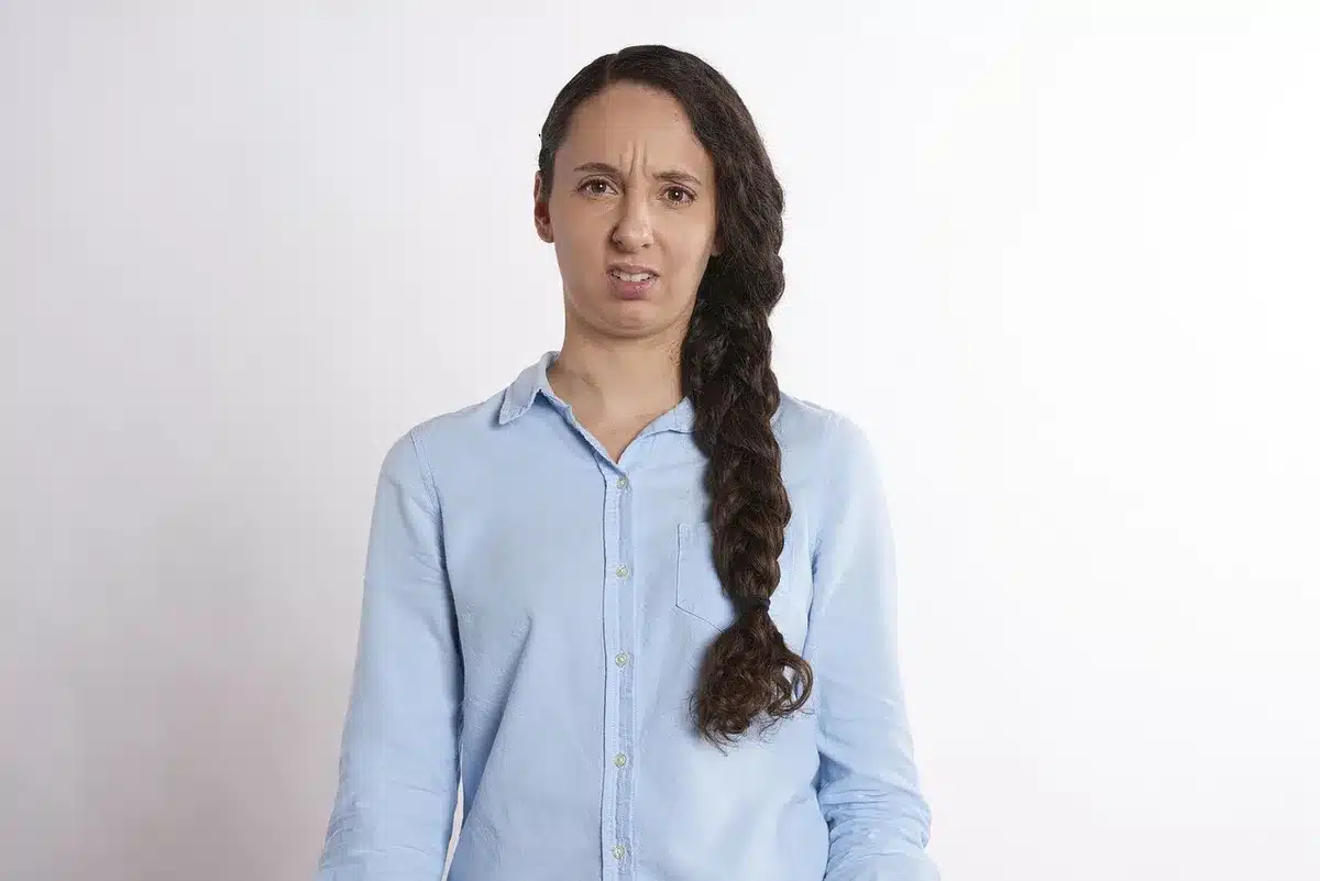 Person looking confused or thoughtful while taking a quiz