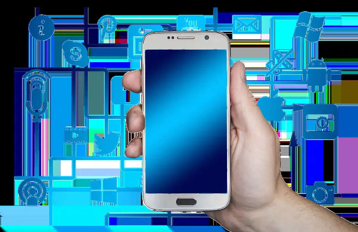 Person holding smartphone showing social media roast or compliment comment on screen