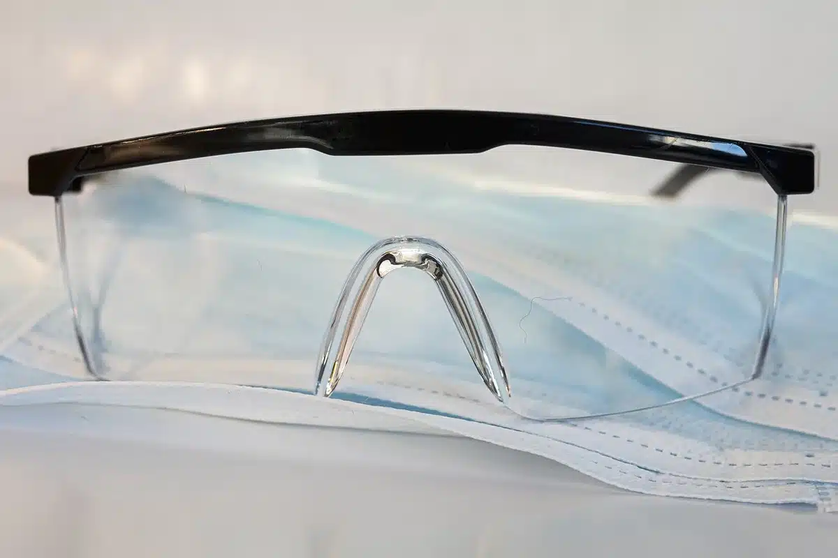 Doctor examining a healing scalp incision for signs of infection