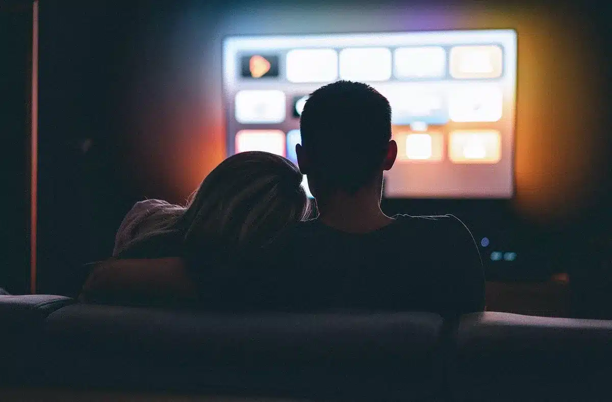 Diverse audience watching a political news program on TV