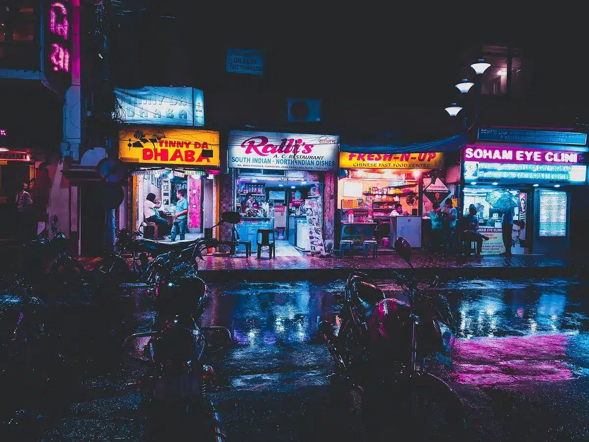 Storefronts and signs showing a fictional town name as a visual gag
