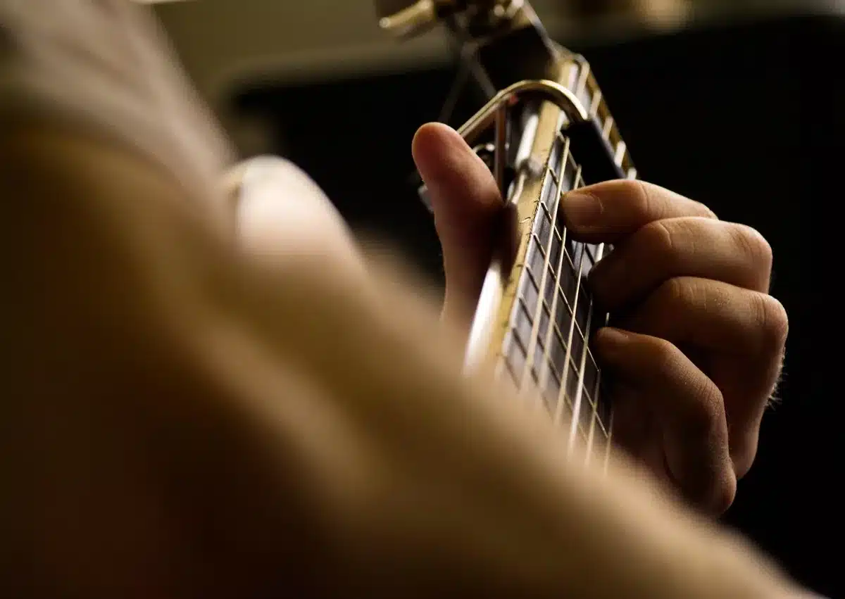 Two acoustic guitars in a recording studio setting