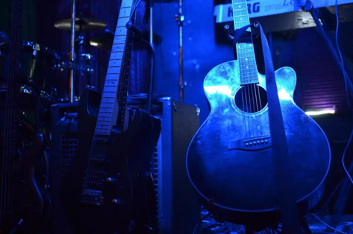 Artists and industry figures mingling backstage at a music showcase