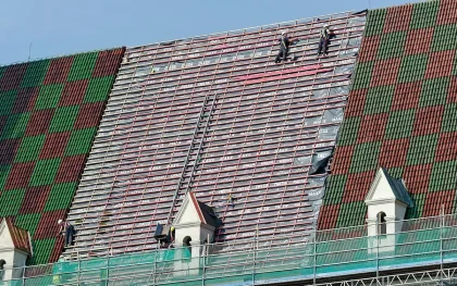 Landmarked hotel façade covered in scaffolding and netting during restoration