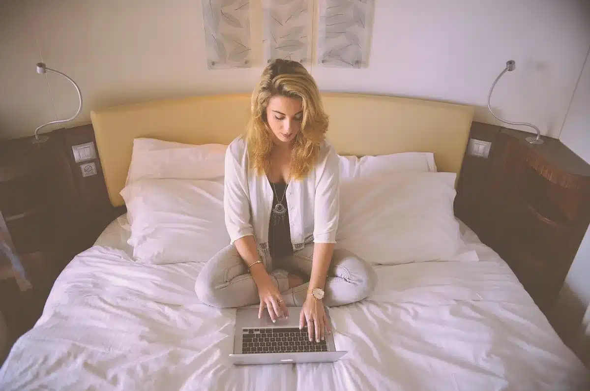 Person checking an online drop on a laptop with a clock