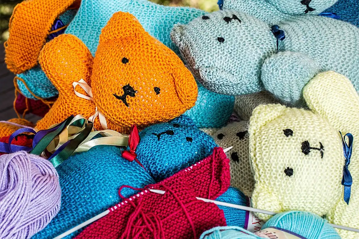 Assorted small plush sidekick toys on a store shelf illustrating merchandising appeal