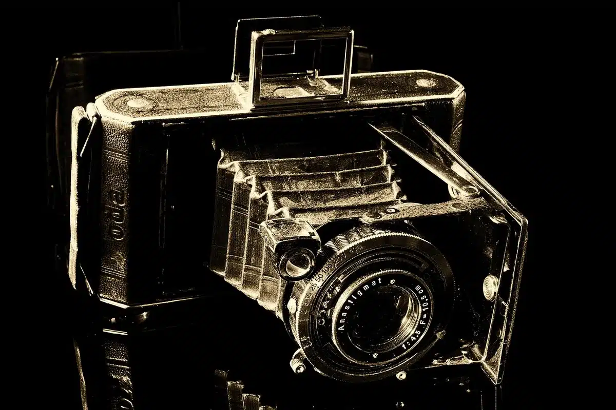 Silhouette of a film set with clapboard and camera rig, anonymous crew in studio
