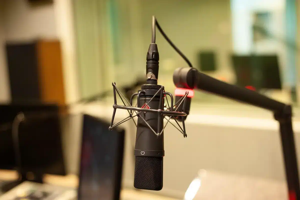 Empty interview chair on a small studio set, spotlighted