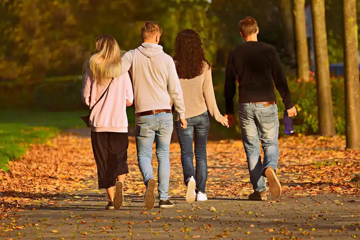 Group of models taking a final walk together on a runway