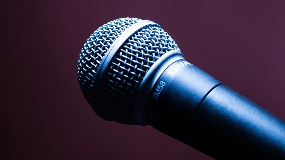 Close-miked vocal setup in studio showing microphone and headphones